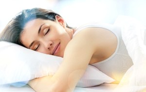 Woman sleeping with sleep apnea in Lincoln