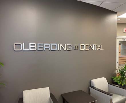 Olberding Dental sign on wall of dental office in Lincoln