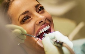 Woman receiving tooth contouring