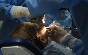Dentist performing surgery