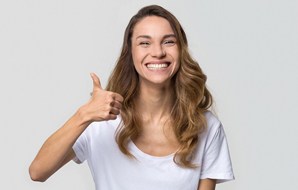 happy woman giving thumbs up
