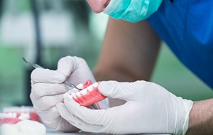 Dentist working on denture