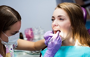 Patient in Lincoln talking to dentist about dental implants