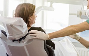 Patient in dental exam room after root canal therapy