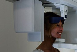 Woman receiving 3D cone beam dental scans