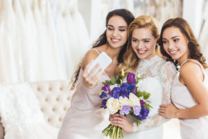 Women taking a selfie at a wedding