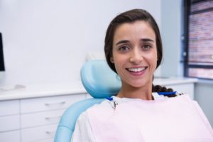 Woman smiling during visit with dentist in Lincoln 