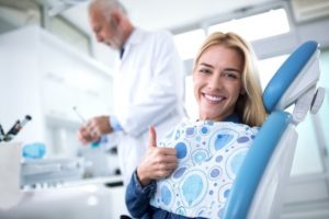 Woman at the dentist’s office receiving a smile makeover.