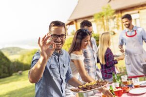 Smiling man at barbeque 