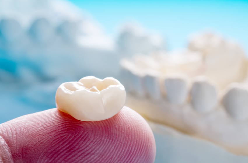 Dental crown on fingertip